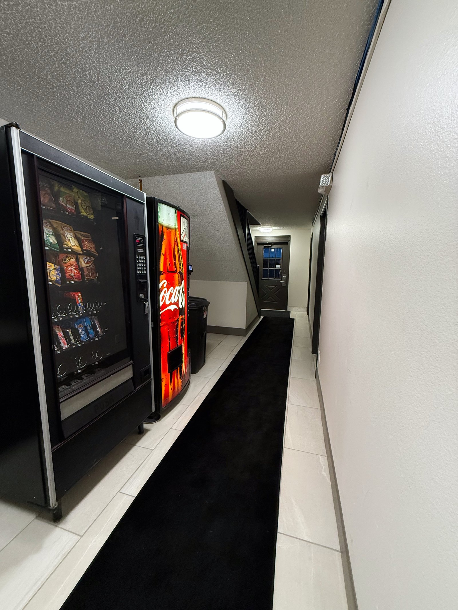 Hermiston Inn & Suites interior corridor with room doors