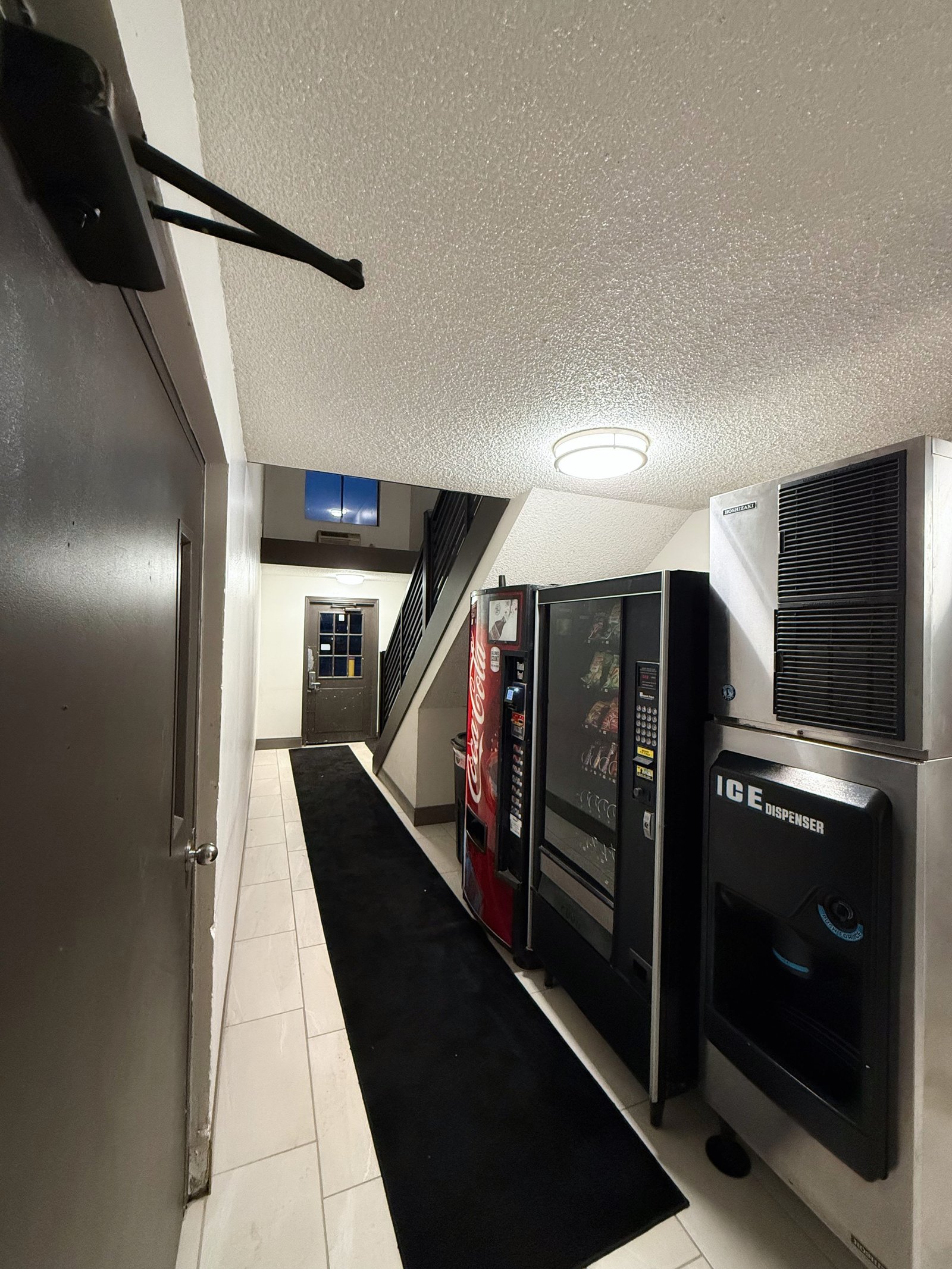 Hermiston Inn & Suites interior corridor with room doors