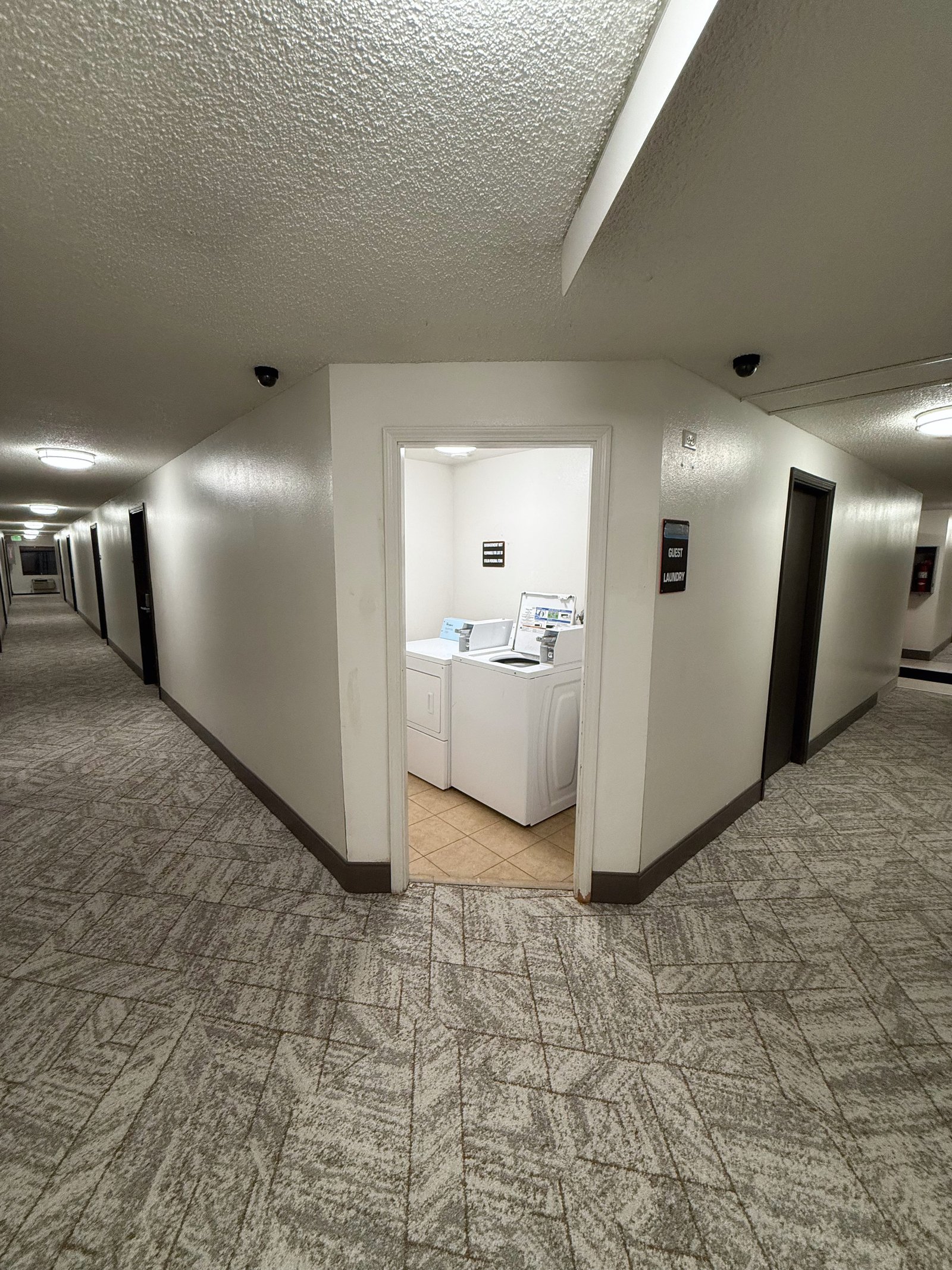 Hermiston Inn & Suites interior corridor with room doors