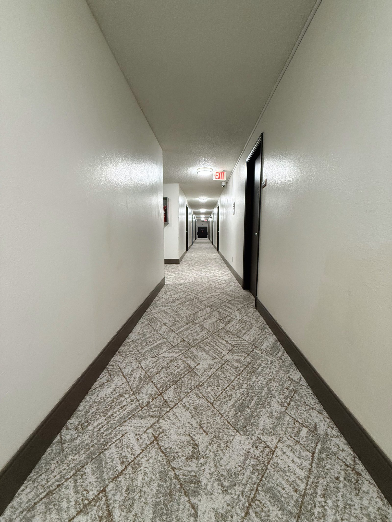 Hermiston Inn & Suites guest hallway leading to rooms